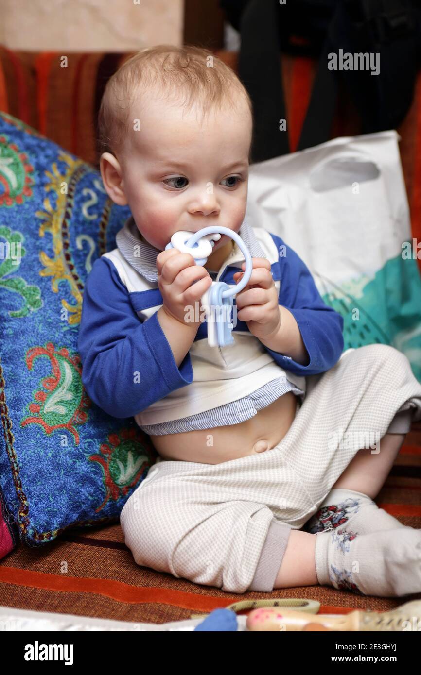 Baby child hand ring toy hires stock photography and images Alamy