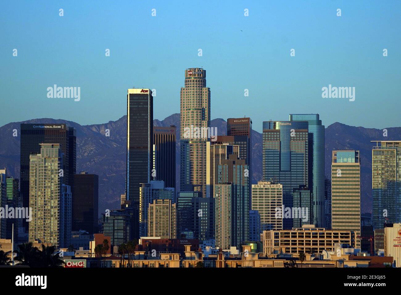 A general view of the downtown Los Angeles skyline and the San Gabriel Mountains, Sunday, Jan. 17, 2021, in Los Angeles. Stock Photo