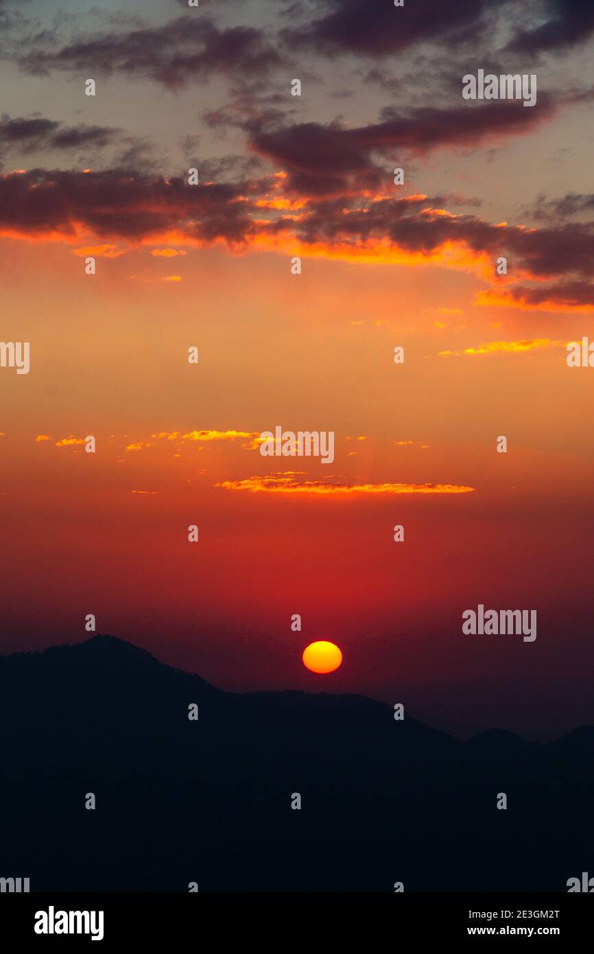 A colorful sunset over the Mountain Stock Photo