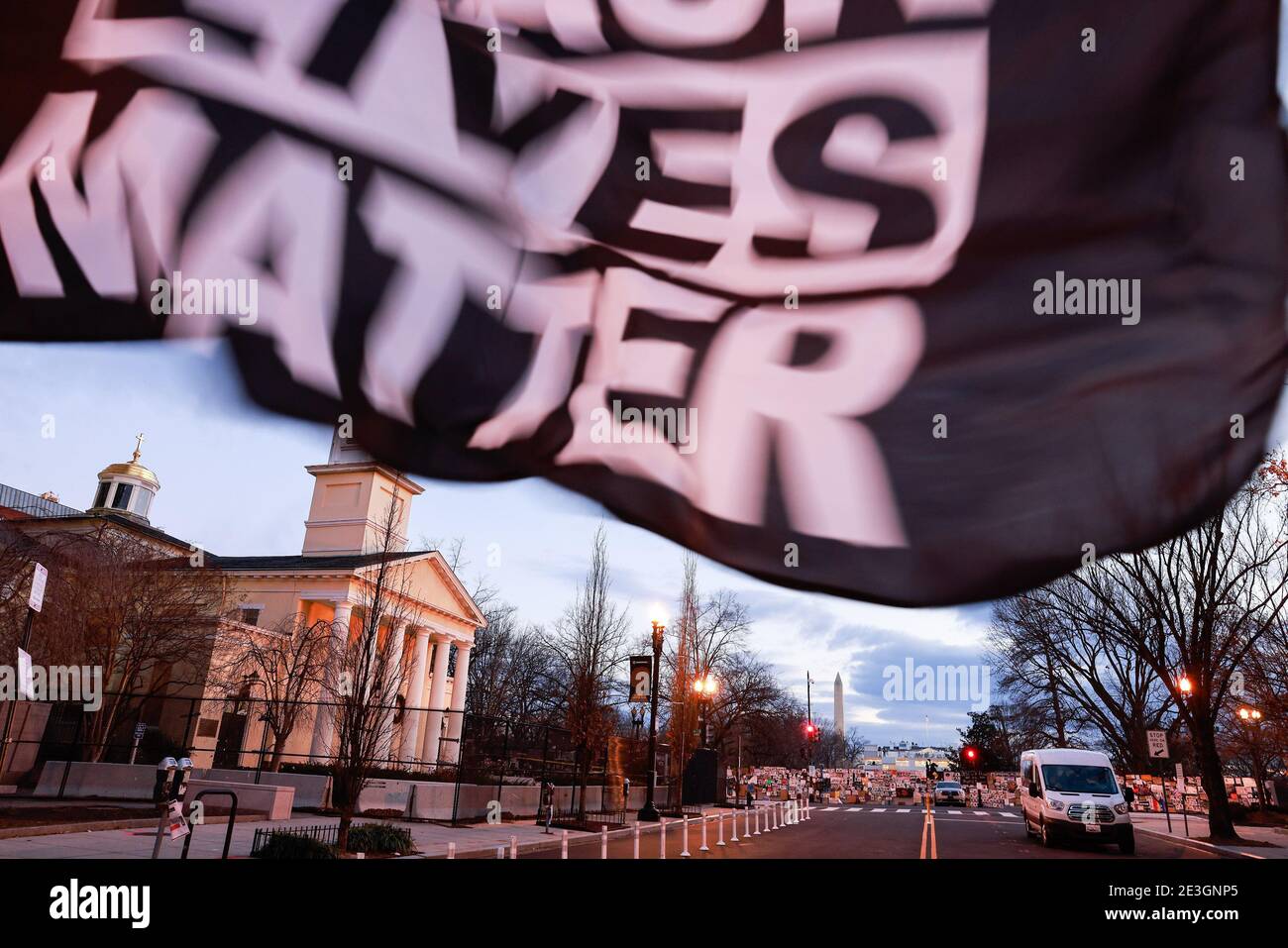 Washington, United States. 18th Jan, 2021. A Black Lives Matter flag flies on Black Lives Matter Plaza Northwest during the Martin Luther King Jr. Day near a church where Donald J. Trump held an upside down Bible after anti-racism protesters were teargased. President elect Joe Biden will be inaugurated Wednesday. Credit: SOPA Images Limited/Alamy Live News Stock Photo