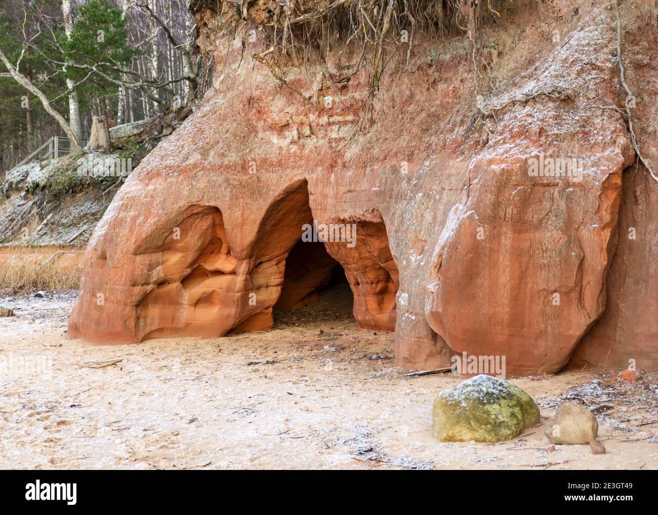 Sea cliff with Devonian sandstone outcrops. During the storm, niches and caves were washed away
