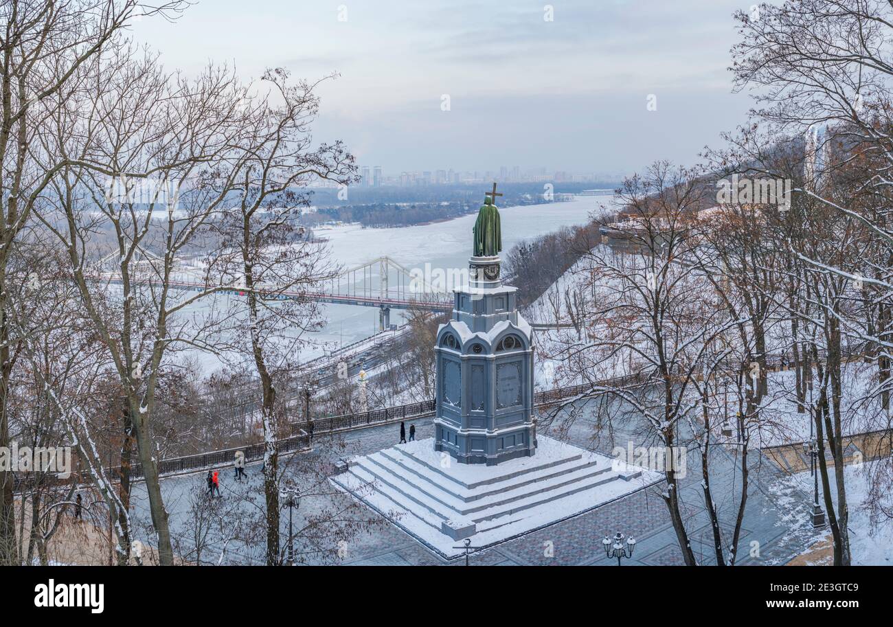 Winter view from Vladimirskaya Gorka in memory of St. Vladimir on the Dnieper river and the Pedestrian bridge in Kiev, Ukraine Stock Photo