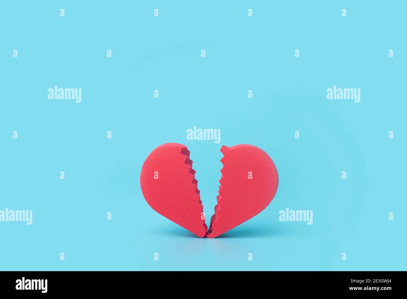 Broken heart on a colored background. Unhappy love, betrayal, quarrel,  breakup concept Stock Photo - Alamy