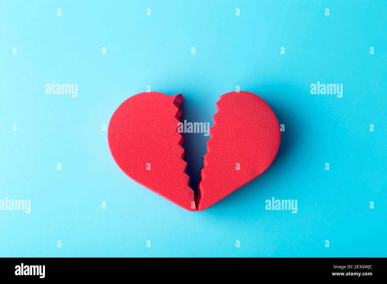 Broken heart on a colored background. Unhappy love, betrayal ...