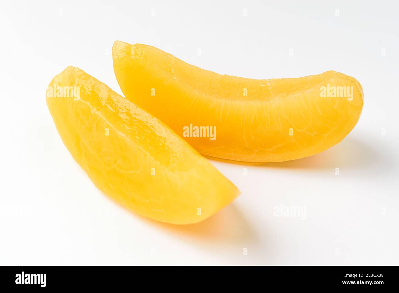 Canned peaches on a white background Stock Photo
