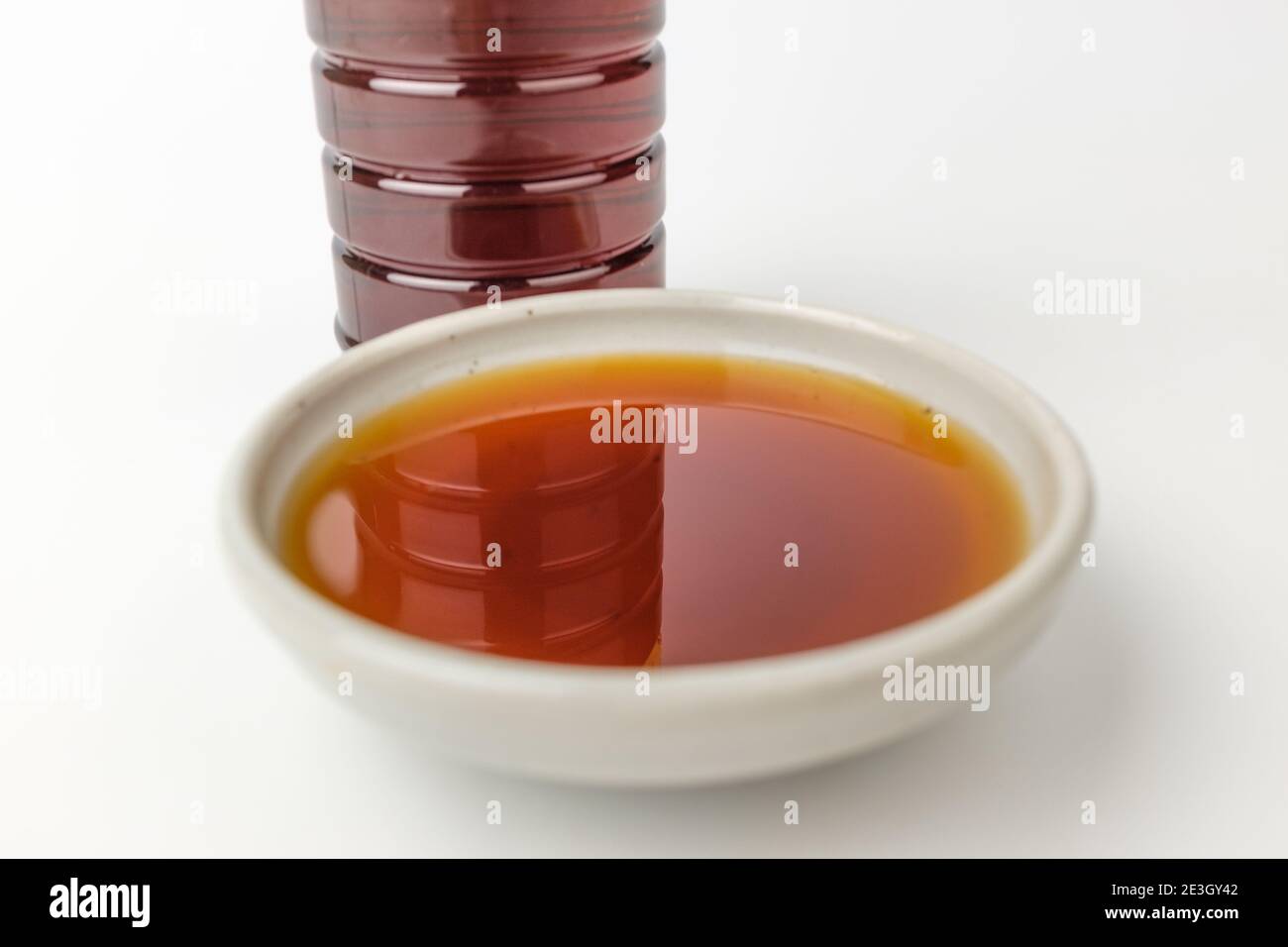 Anchovy fish sauce on white background Stock Photo Alamy
