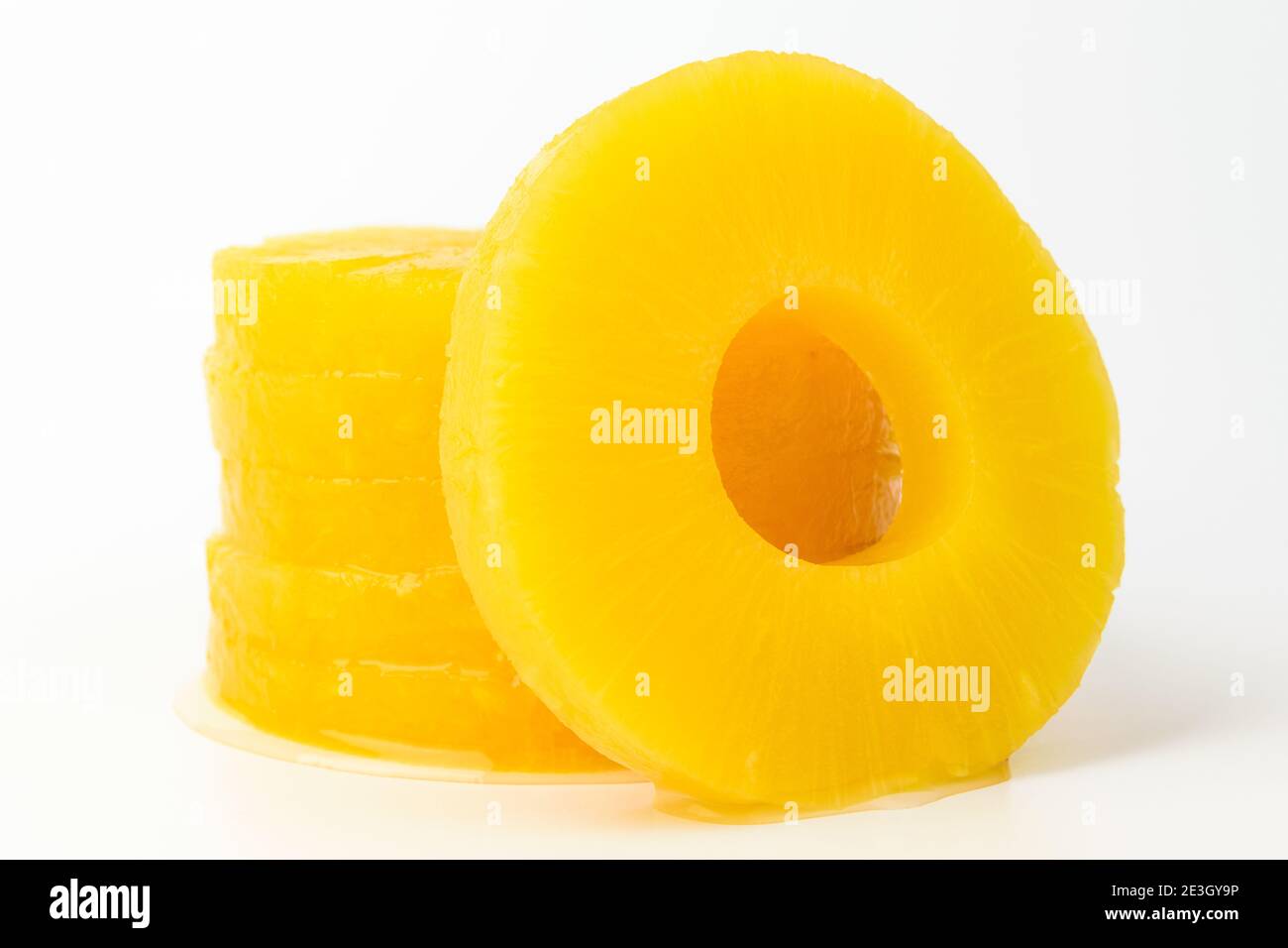 Pineapple slices on white background Stock Photo