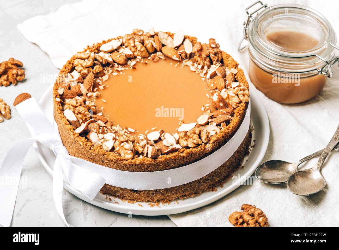 Cheesecake with salted caramel and nuts Stock Photo Alamy