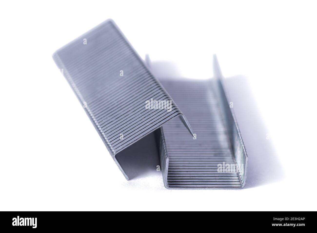 Blue stapler and staples Isolated on white background. Stock Photo