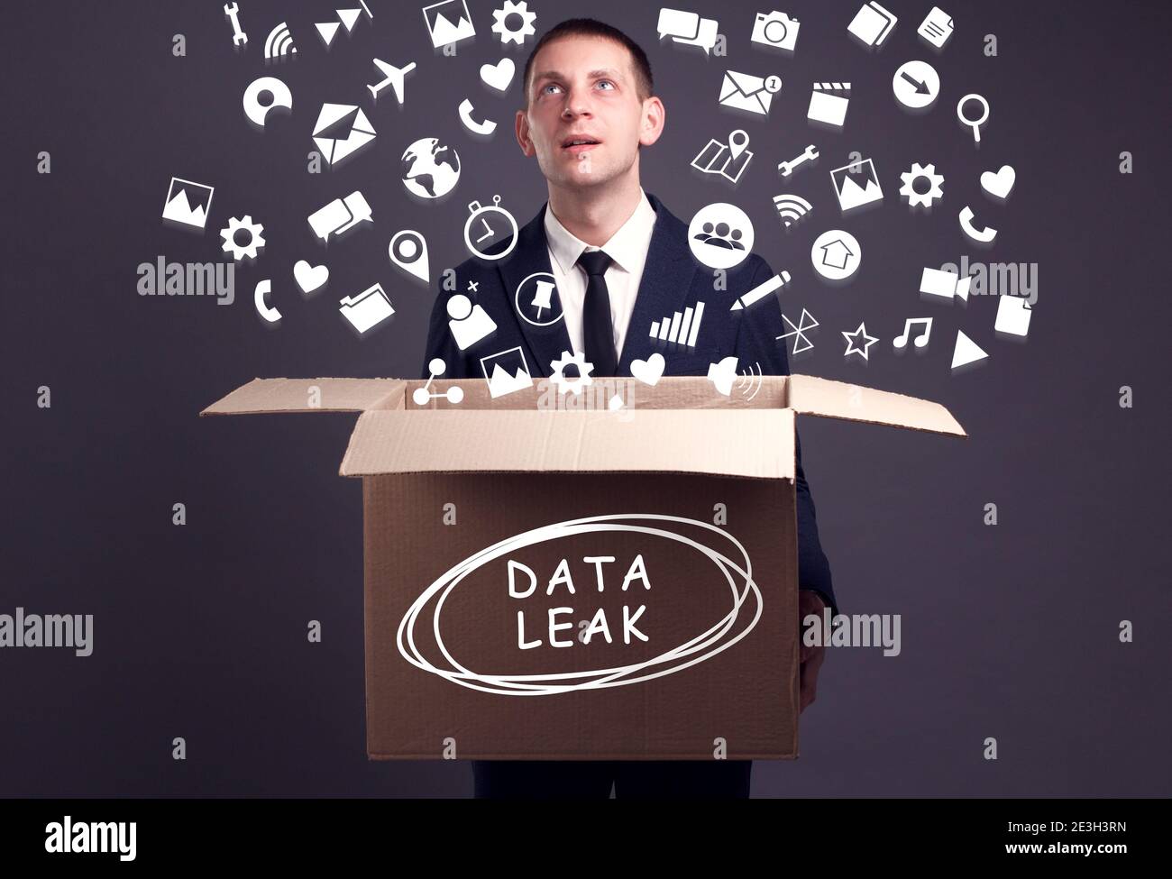 Business, technology, internet and network concept. A young businessman collects information to become successful: Data leak Stock Photo