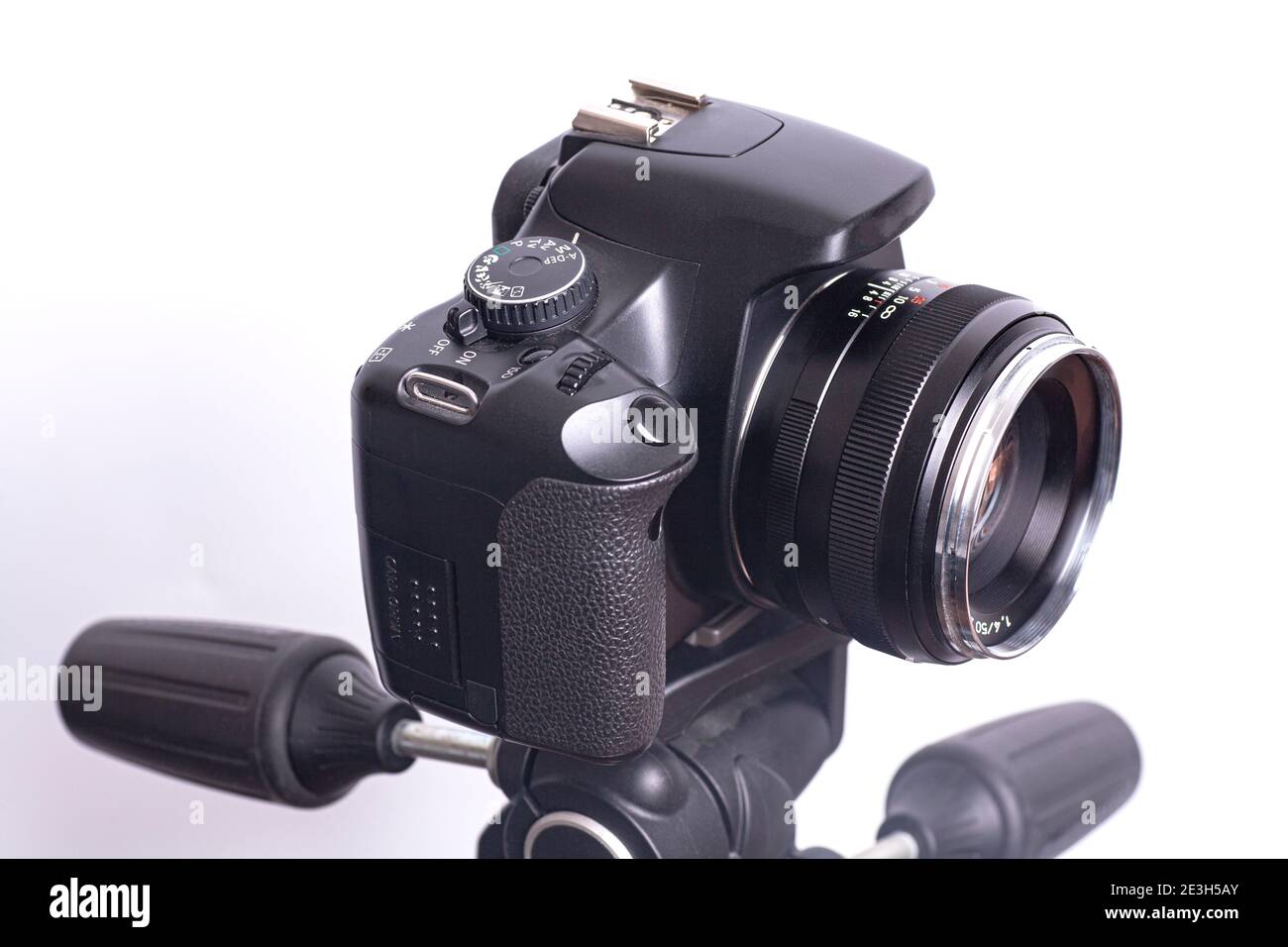 Digital photo camera on black tripod isolated on white background Stock ...