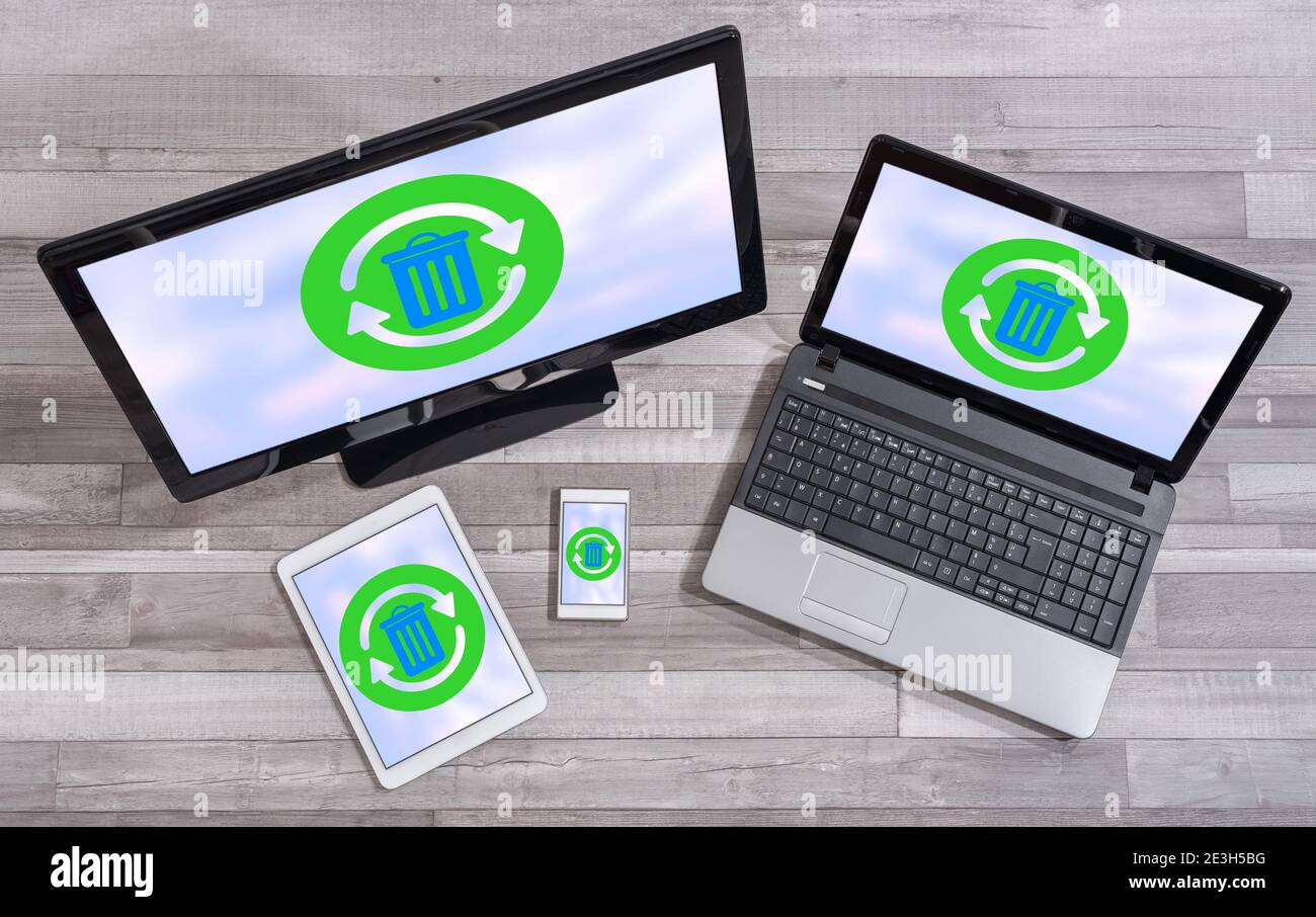 Recycling concept shown on different information technology devices Stock Photo