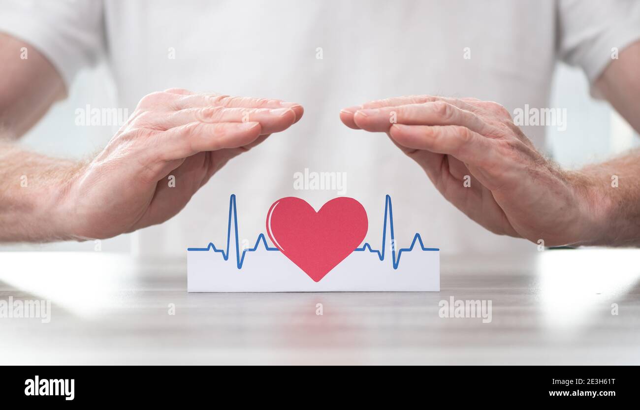 Heartbeat symbol protected by hands - Concept of health insurance Stock ...