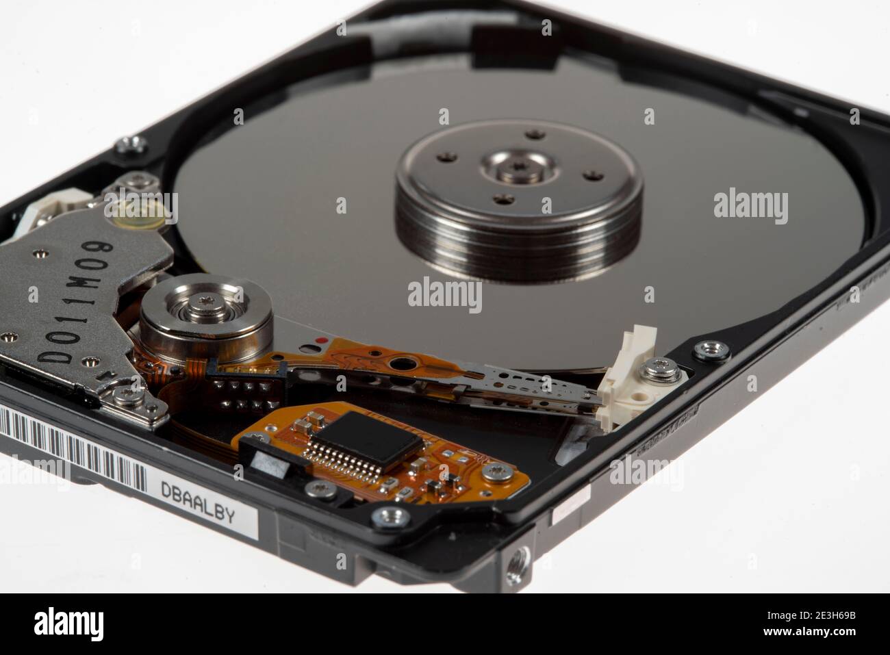Computer hard disk, opened, read-write head on the storage disk.  Symbol image, Stock Photo