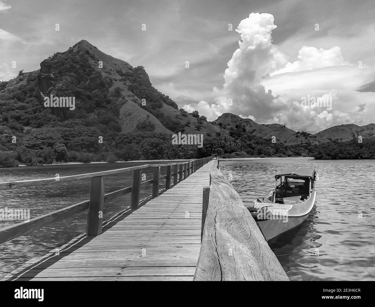 Tropical Paradise.Tourism resort destination ,summer vacation trip and travel concept.Marijite Bridge wooden bridge walkaway, Komodo Island Stock Photo