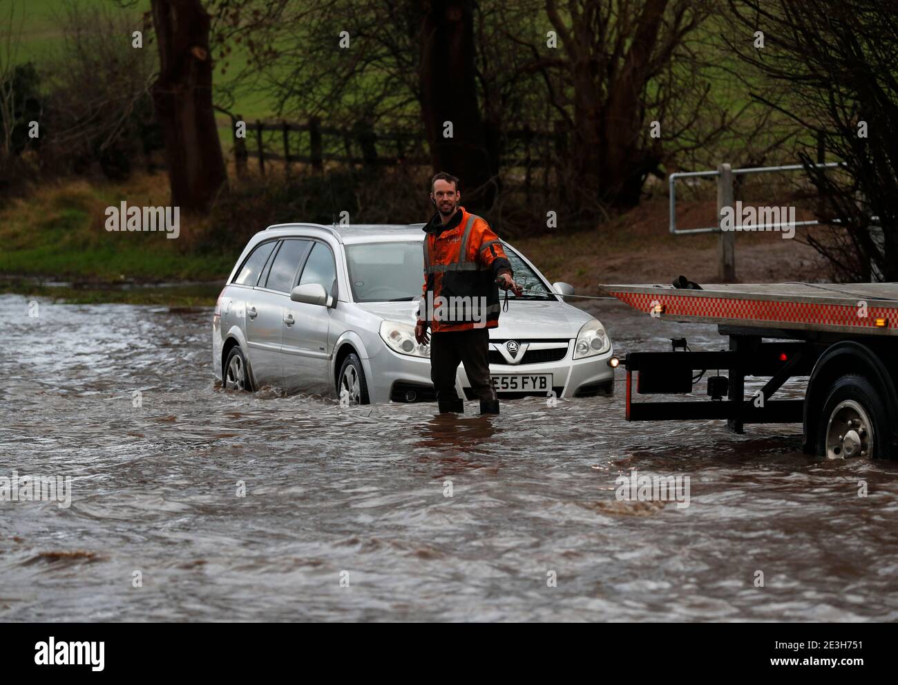 Hathern, Leicestershire, UK. 19th January 2021. UK weather. A recovery driver prepares to pull a car from flood water. Storm Christoph is set to bring widespread flooding to parts of England. Credit Darren Staples/Alamy Live News. Stock Photo