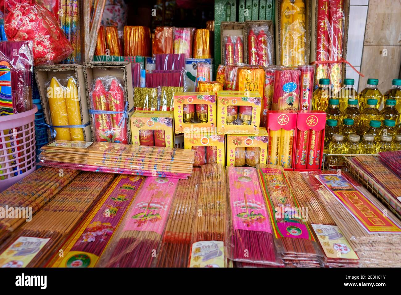 Candles and incense sticks (or joss sticks) sold to be used as offerings during Chinese New Year festival in Bangkok, Thailand. Stock Photo