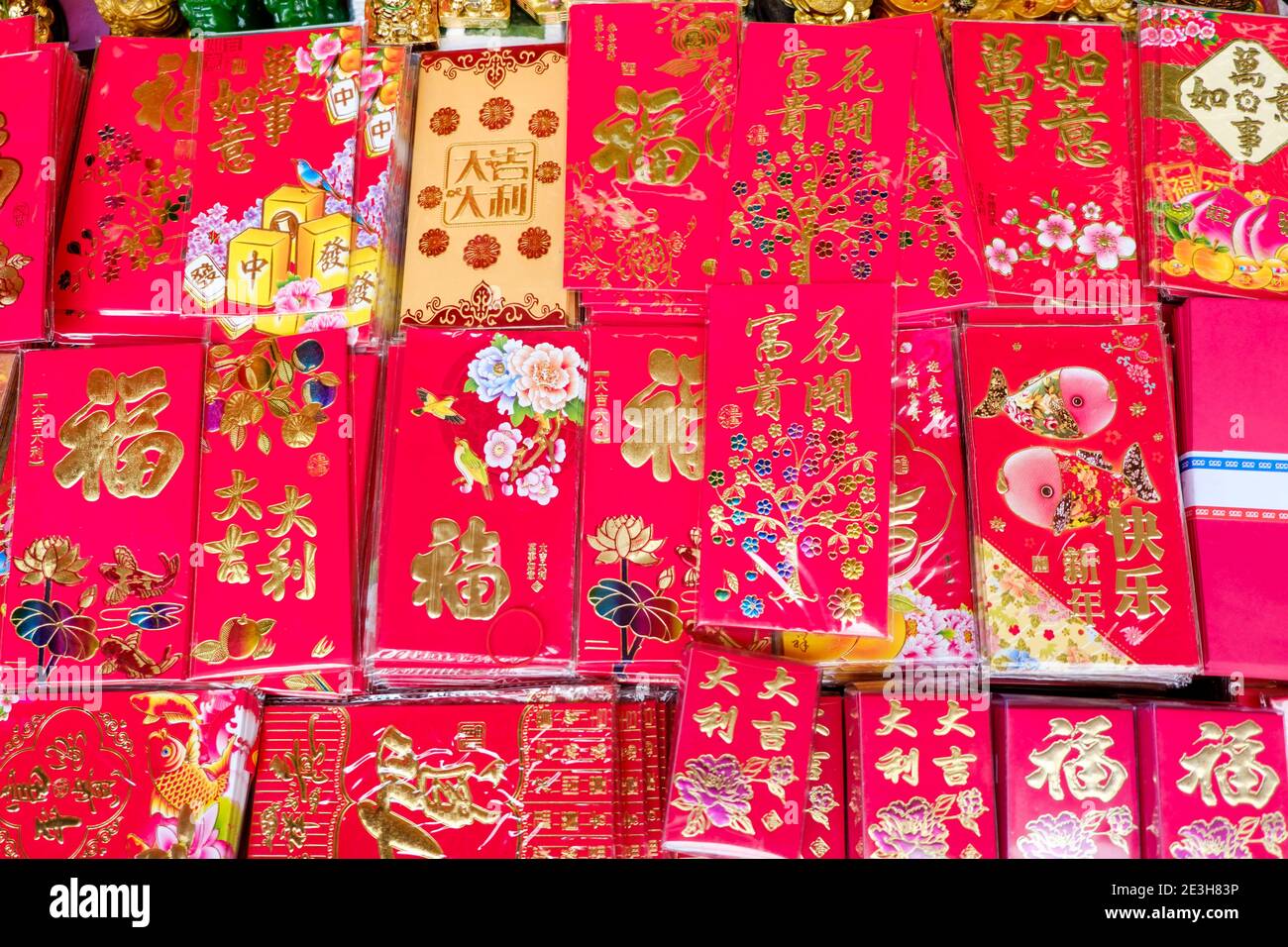 Traditional red envelopes ('hóngbao') given with money inside as gifts during New Year and other occasions in China and many parts of SE Asia. Stock Photo