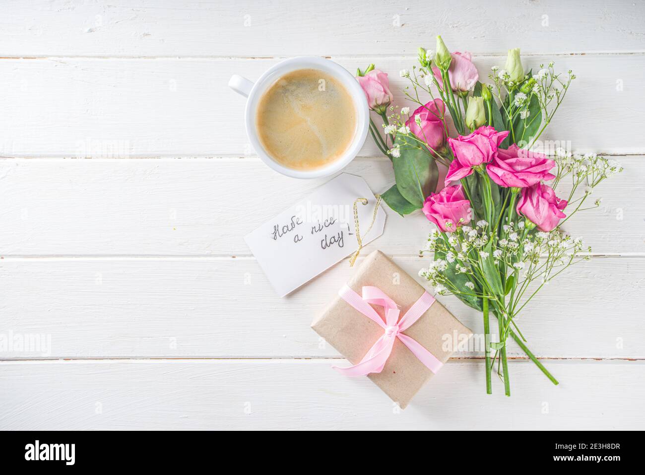 Bouquet of spring, summer flowers, coffee cup and notes good ...