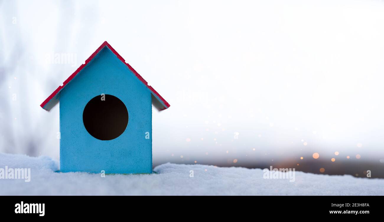 Birdhouse house on the snow. Background natural Stock Photo