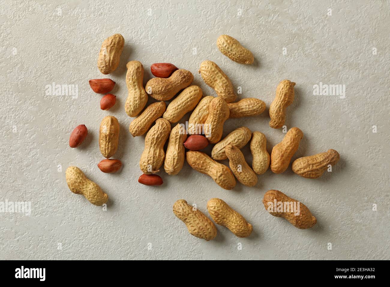 Shelled and unshelled peanut on white background Stock Photo Alamy