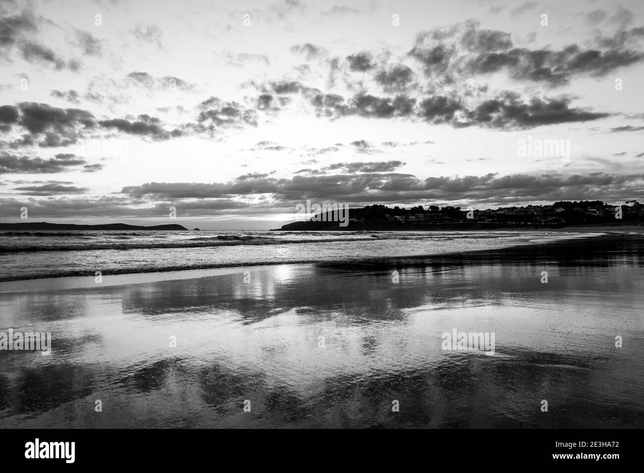 Reflectionsoast at low tide at sunset, Playa de Montalvo, Sanxenxo, Atlantic Ocean, Galicia, Spain Stock Photo