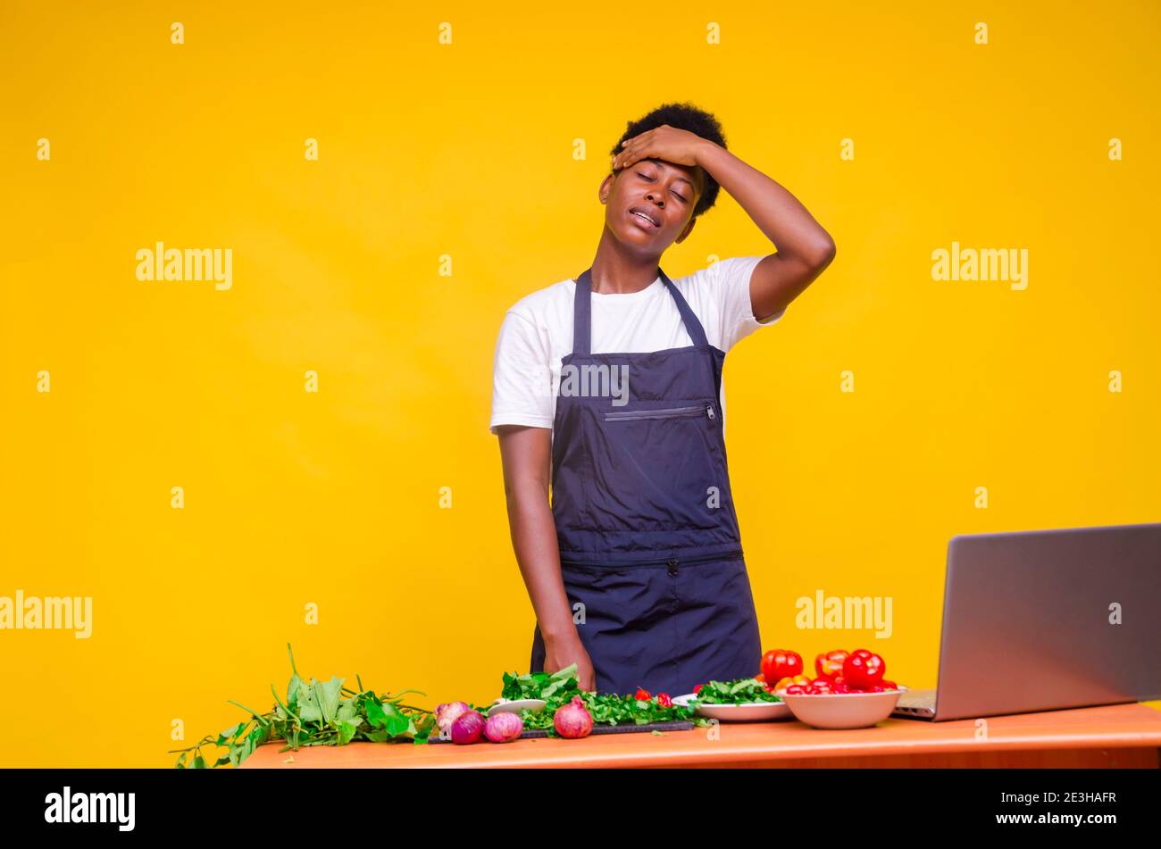 young pretty african cook feeling highly exhausted of her work Stock ...
