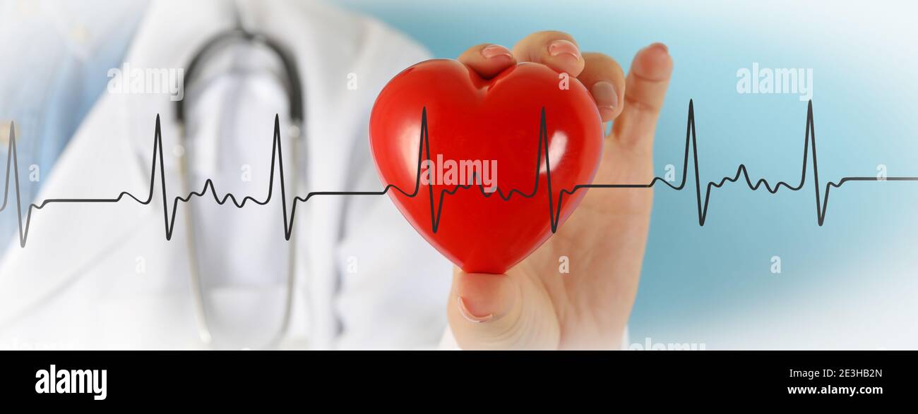 Female doctor with stethoscope holding red heart Stock Photo - Alamy