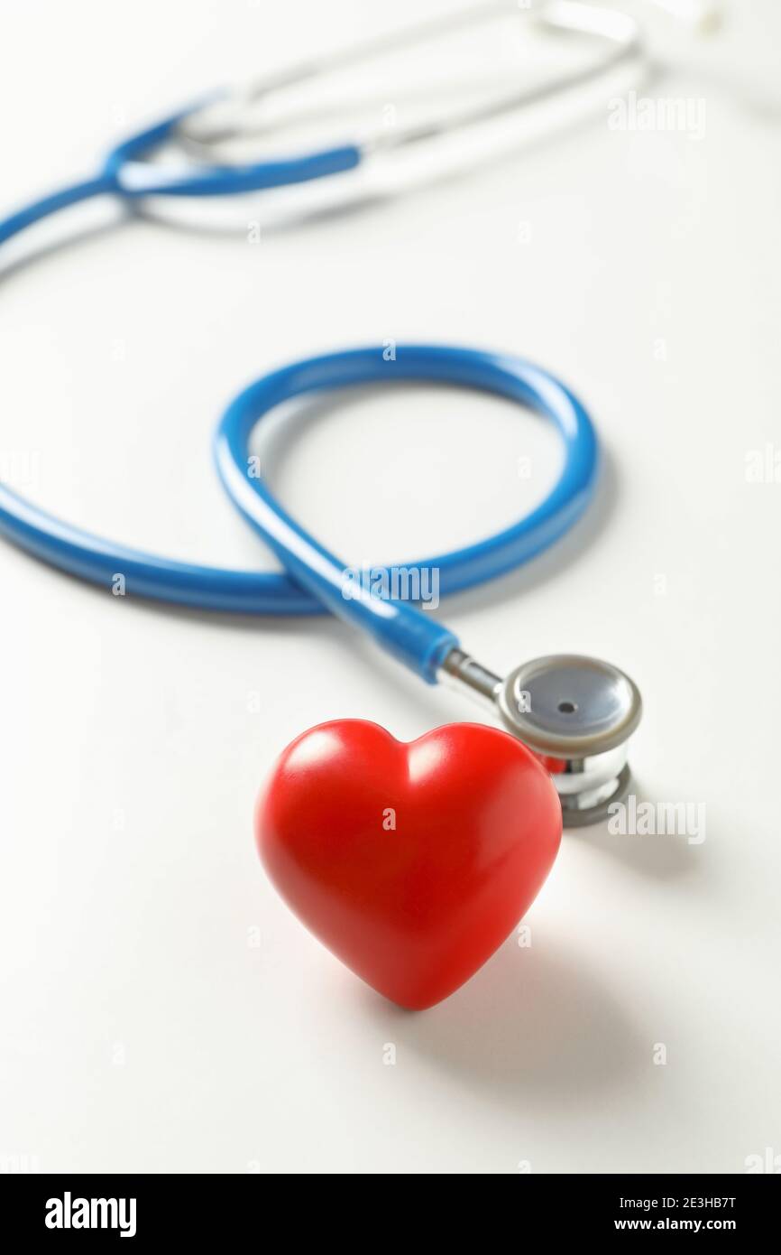 Blue stethoscope and heart on white background Stock Photo - Alamy