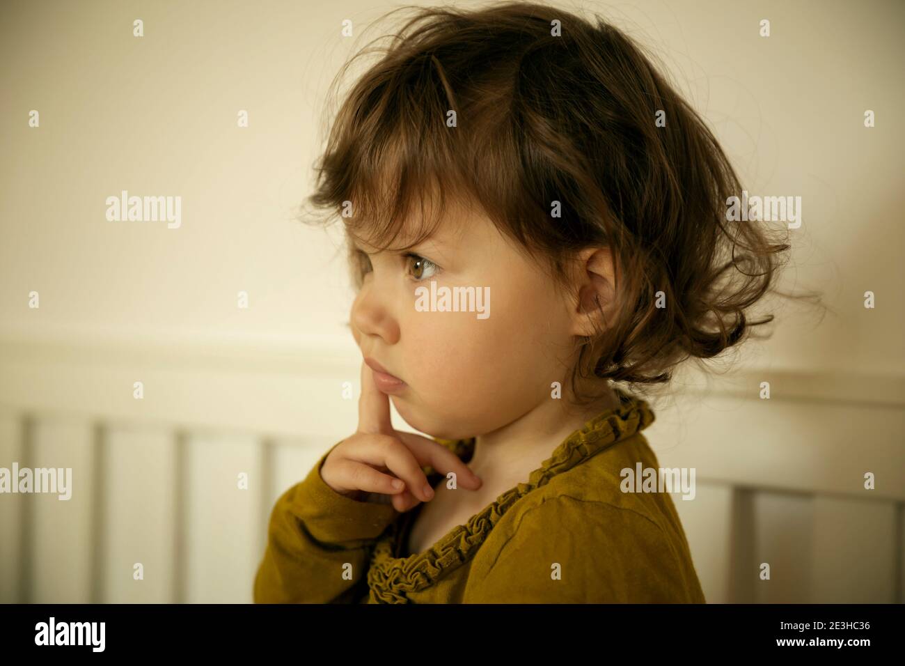Portrait of a thoughtful baby girl Stock Photo