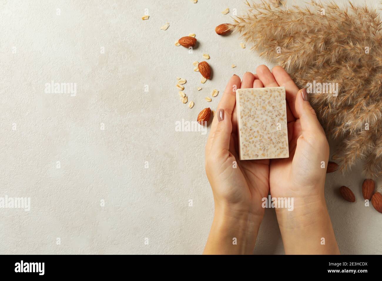 Female hands hold handmade soap on decorated background Stock Photo Alamy