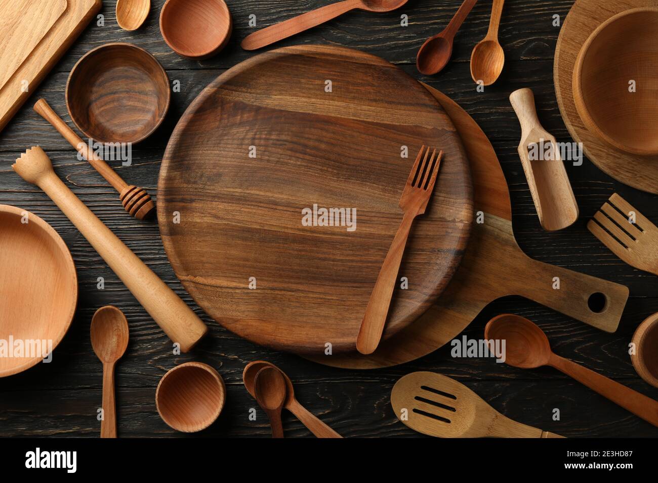 Different wooden kitchenware on wooden table, top view Stock Photo ...