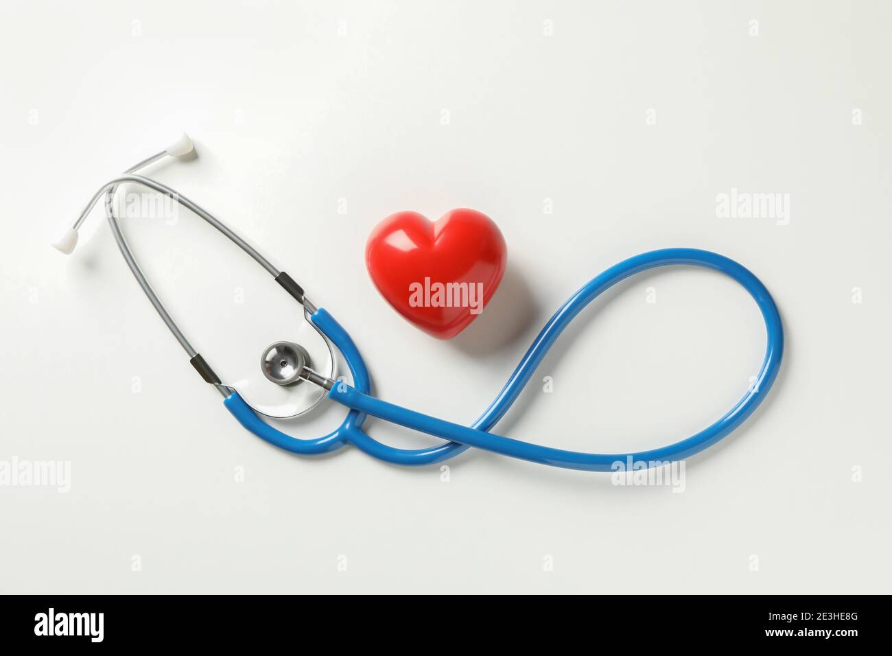 Blue stethoscope and heart on white background Stock Photo - Alamy