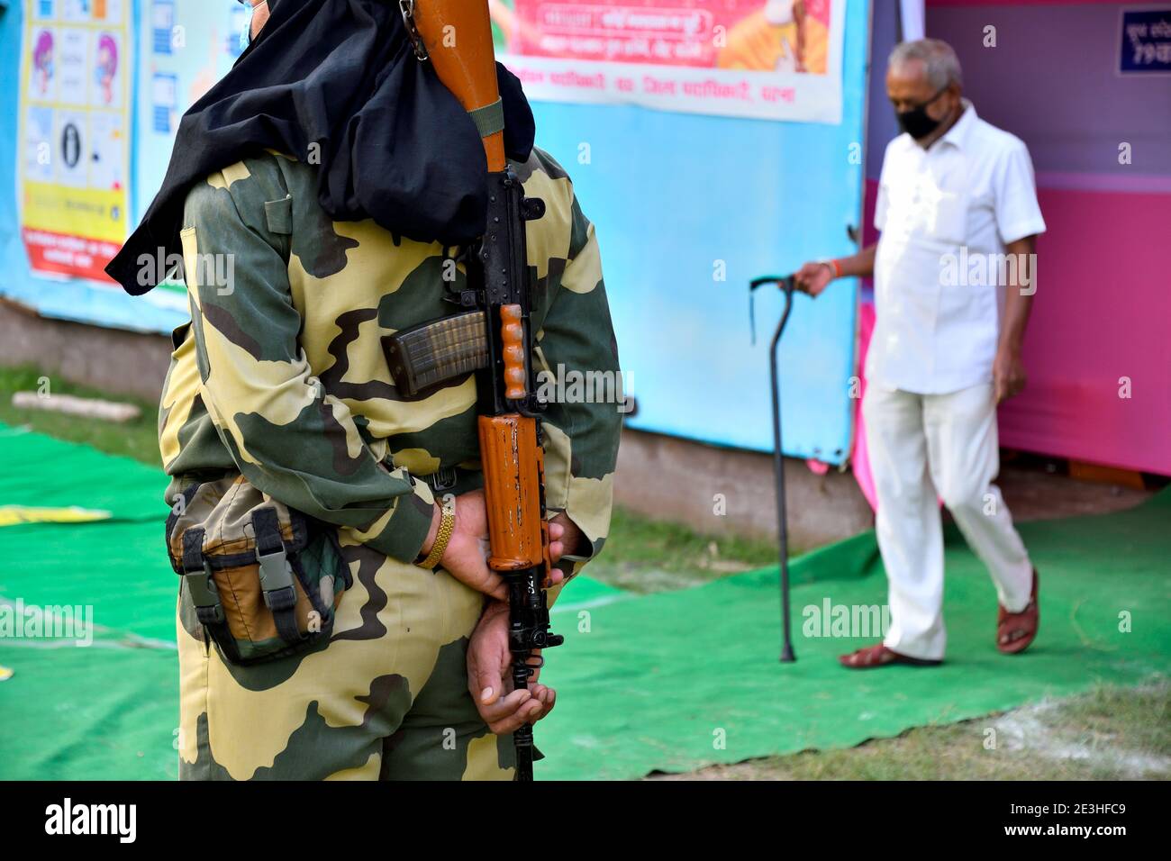 A security personnel stands by on duty during the polling day. Stock Photo