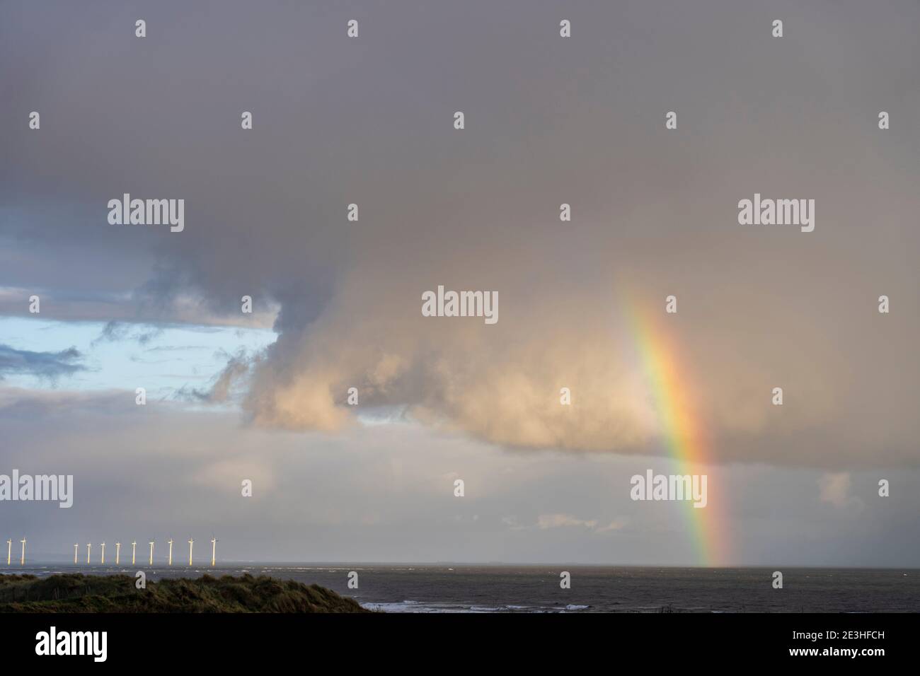 rainbow & clouds over north sea Stock Photo