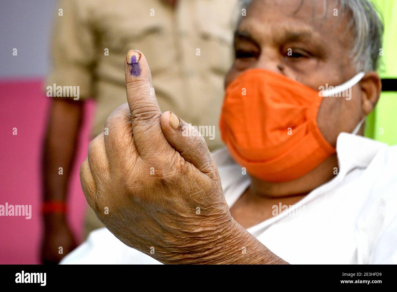 An elderly voter showing indelible ink on his finger after casting his vote. Stock Photo