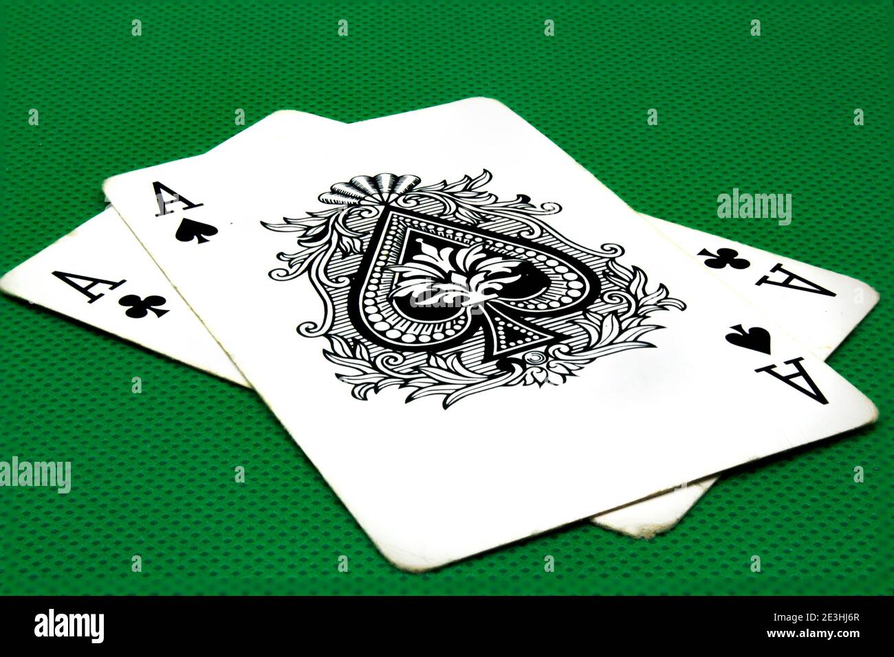 Two aces on green poker table Stock Photo