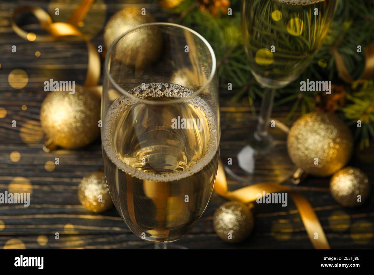 Glasses of champagne and new year accessories on wooden table Stock ...