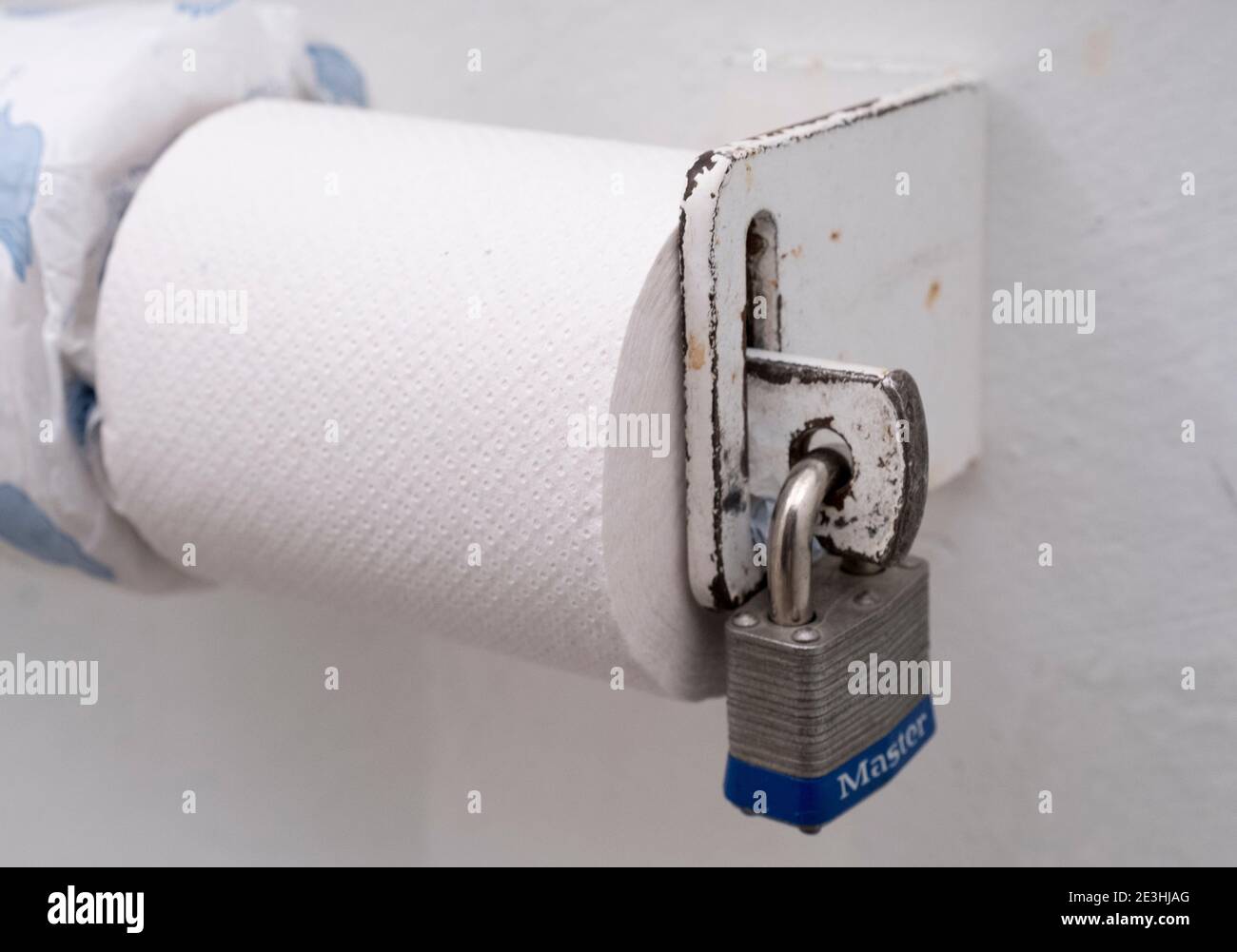Toilet roll locked in place with a padlock at a rest room just off the Bear Tooth highway, Montana, USA. Stock Photo