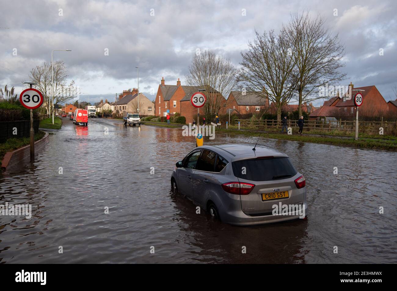 Stranded cars in floodwater on Derby Road in Hathern, Leicestershire. Picture date: Tuesday January 19, 2021. Stock Photo