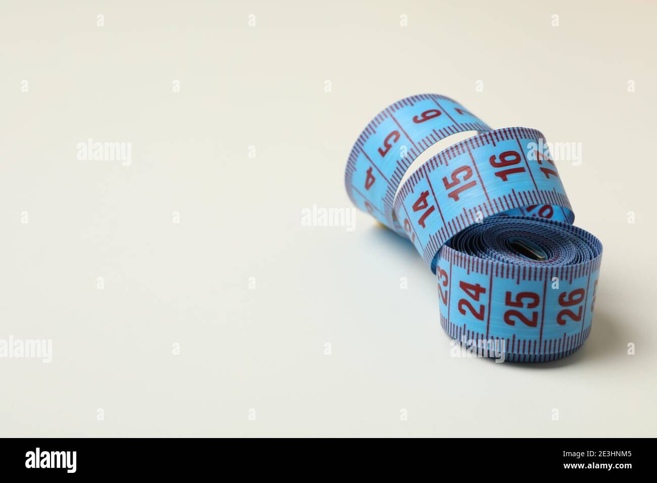 Measuring tape on white background, space for text Stock Photo