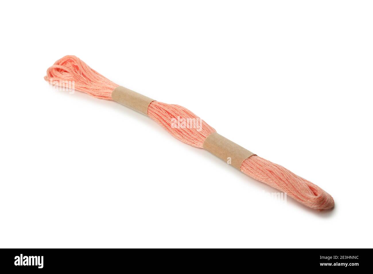 Pink thread isolated on white background, close up Stock Photo - Alamy