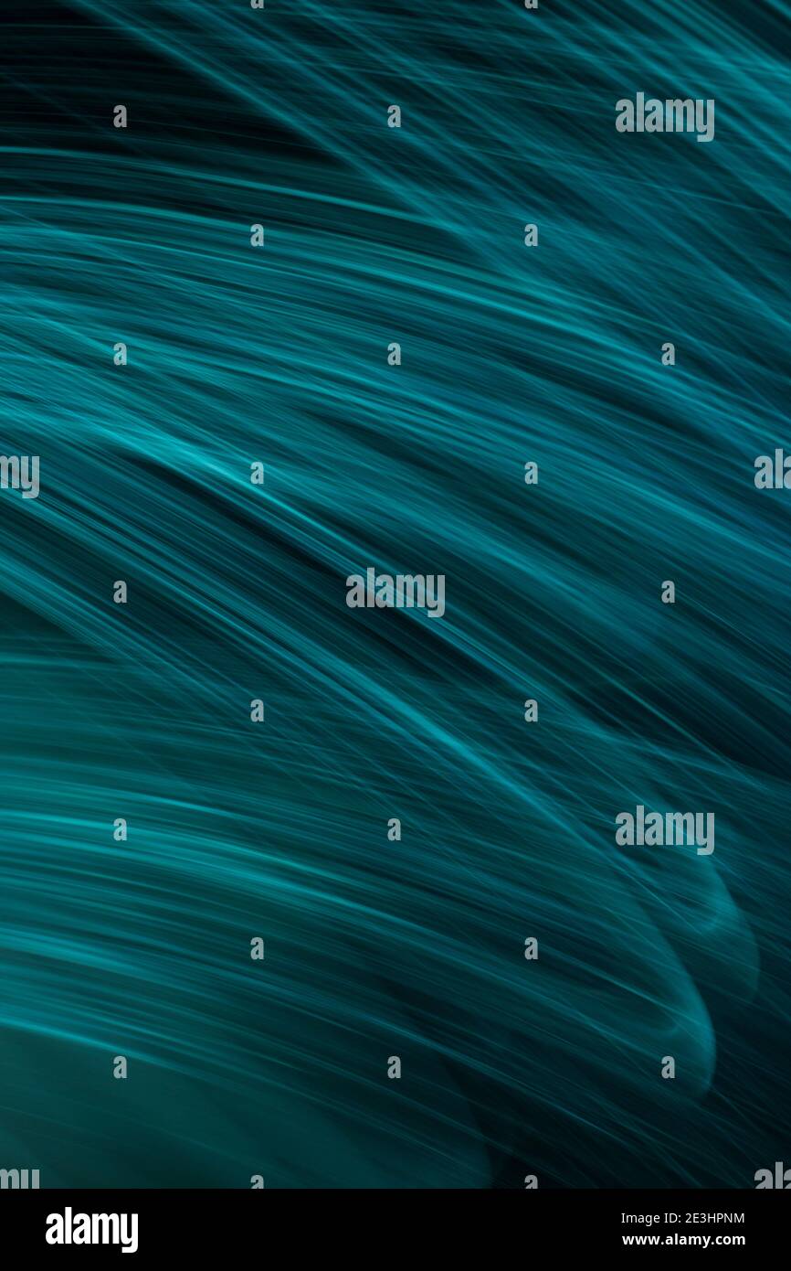 thin blue light lines on a black background Stock Photo