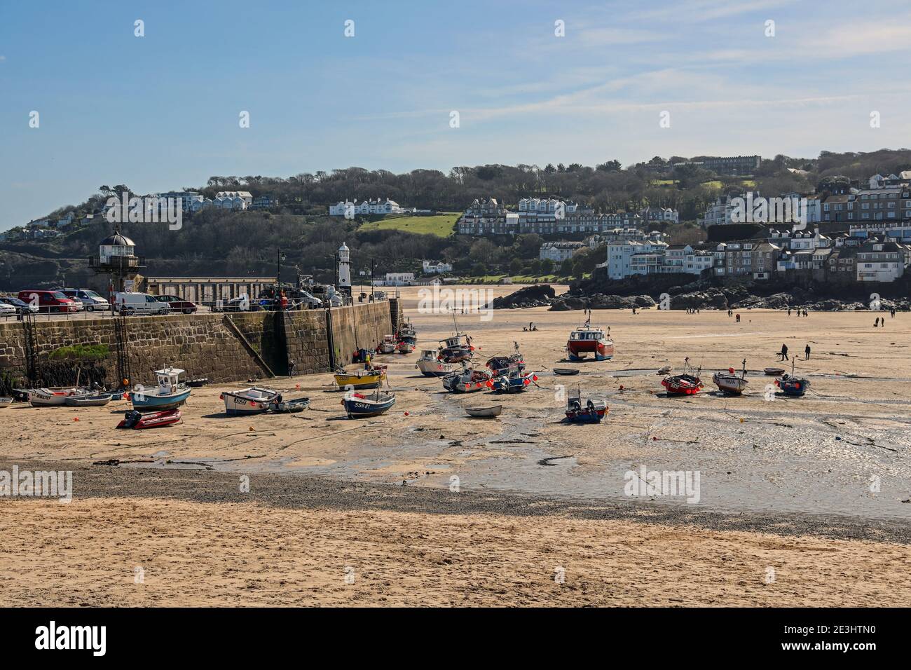 Seaside fishing port of St Ives in Cornwall. Popular with artist and famous for its ‘light’. On the Atlantic coast of Cornwall. Local folk stroll alon Stock Photo