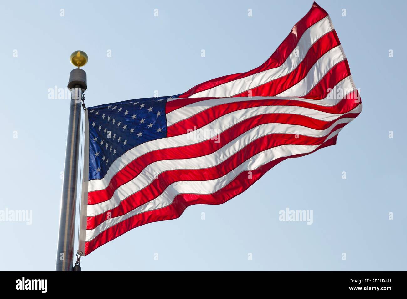 An American flag flying in Washington DC, USA. The national flag is know as Old Glory, the Stars and Stripes and the Star-Spangled banner. Stock Photo