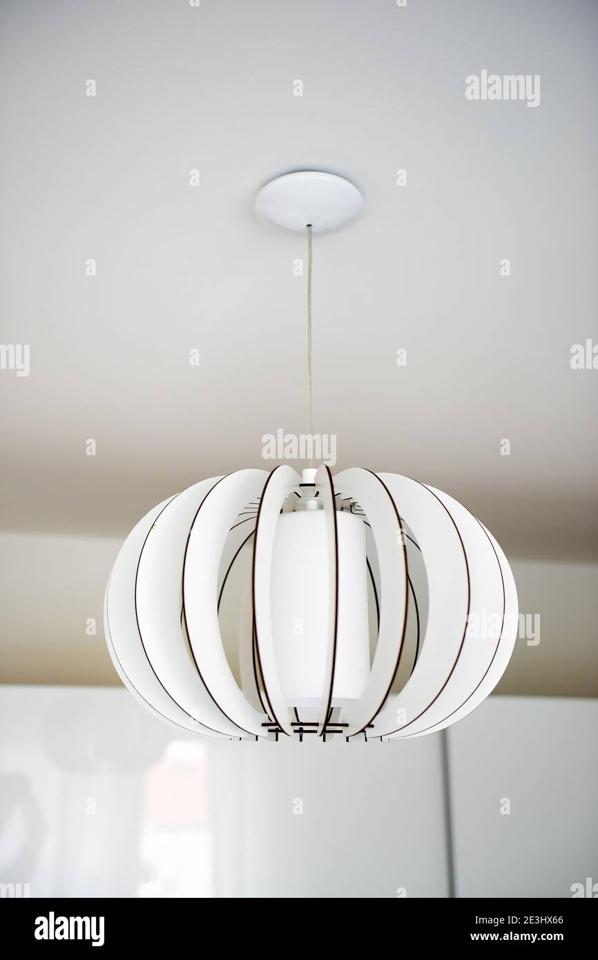 White chandelier in a renovated home Stock Photo