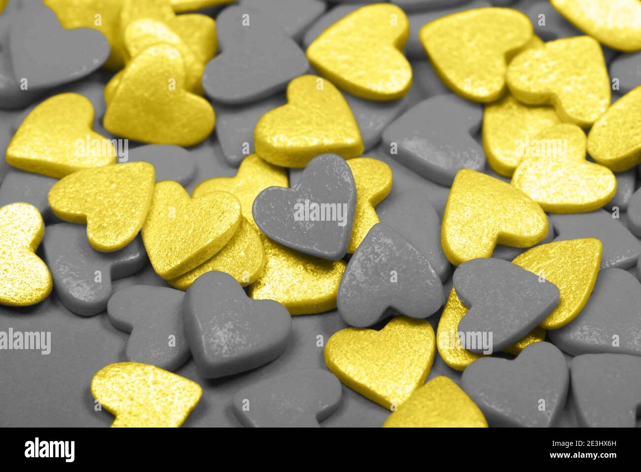 Lots of gray and yellow hearts. The concept of St. Valentine's Day, love, sweets Stock Photo