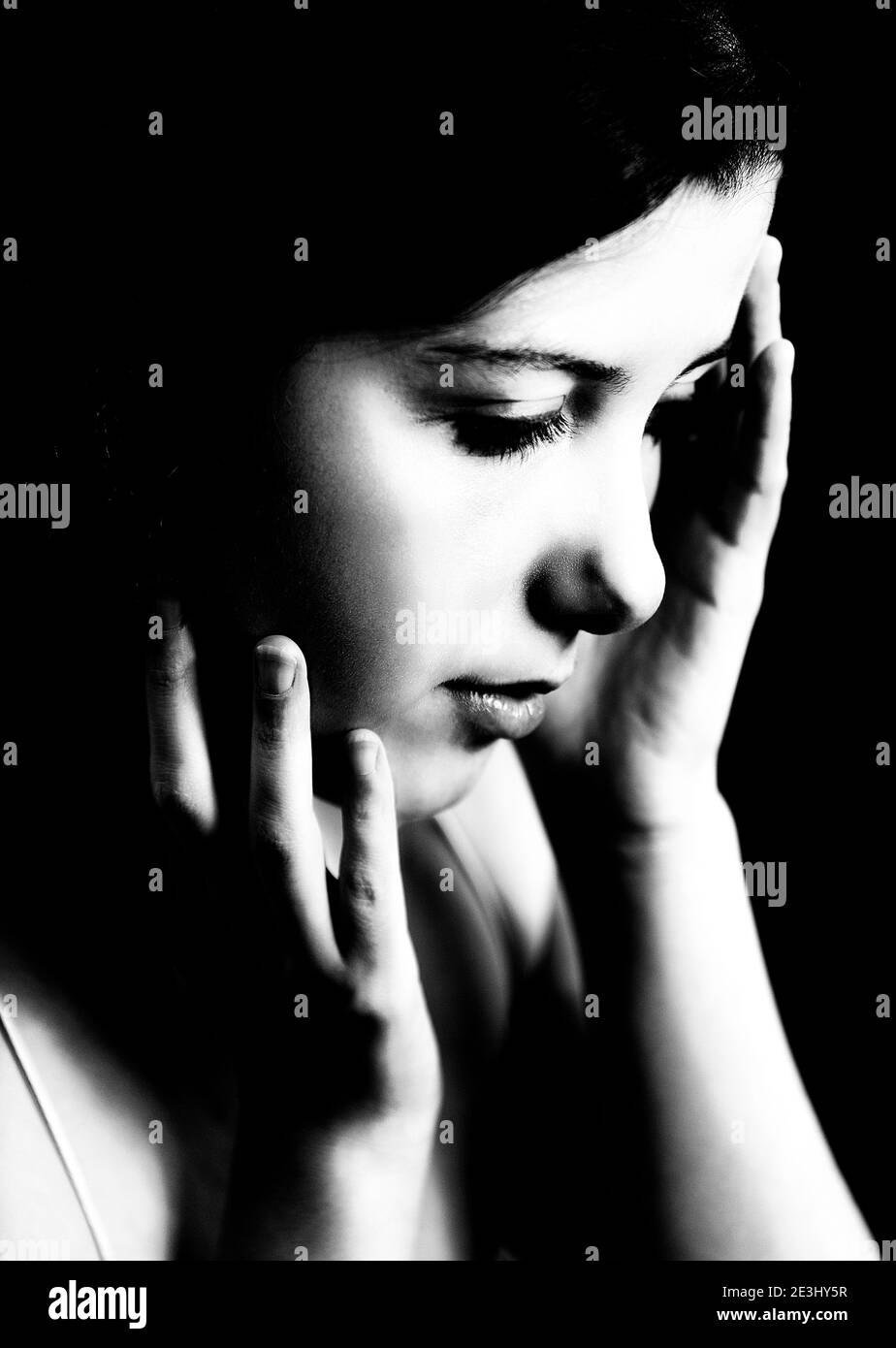 young woman in sad attitude V Stock Photo