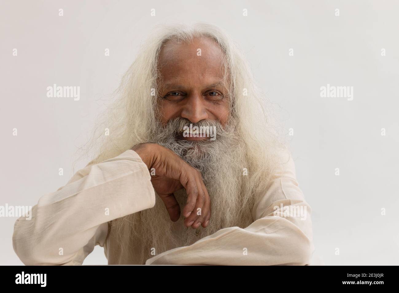 PORTRAIT OF AN OLD MAN WITH WHITE LONG HAIR Stock Photo
