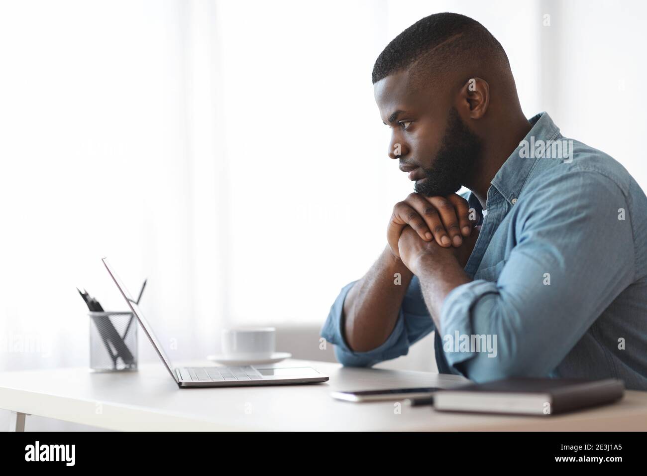 Thoughtful Black Writer Working With Laptop Computer At Home Office ...